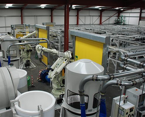 Shell manufacturing system with conveyor